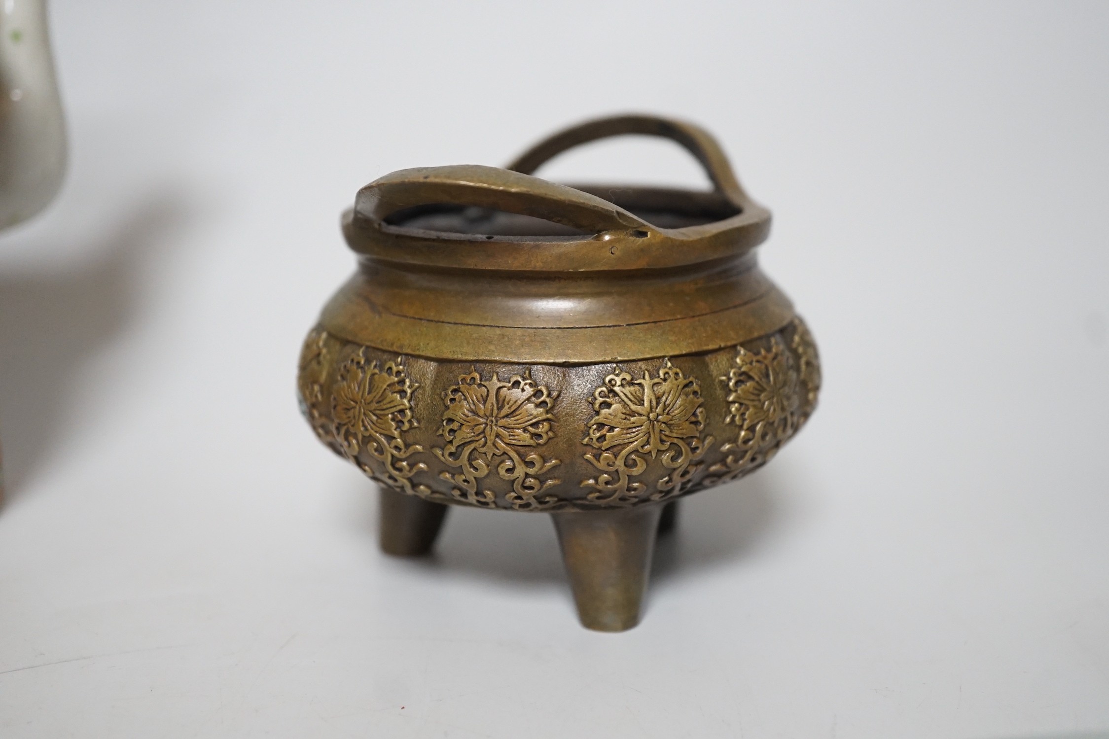 A pair of Chinese celadon ground famille rose plates, a Chinese famille rose tea pot and a bronze censer, plates 26cms diameter